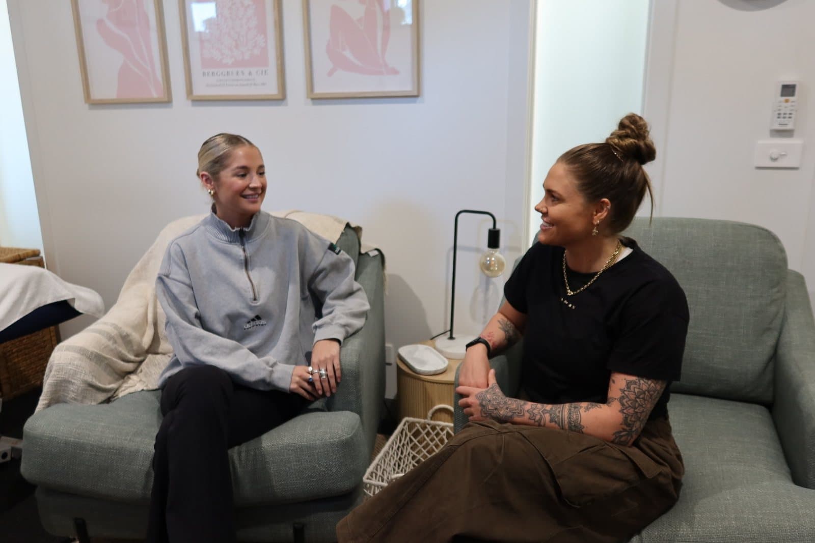 Two people in conversation in the clinic's consulting space.